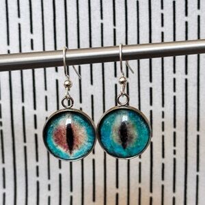 Blue and Brown Mythical Creature Cat Eye Design Silver Earrings